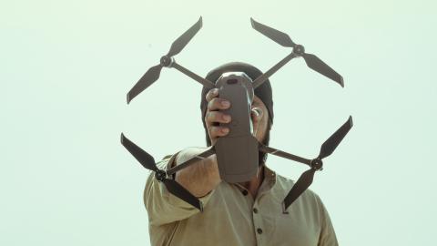 Man with drone in hand